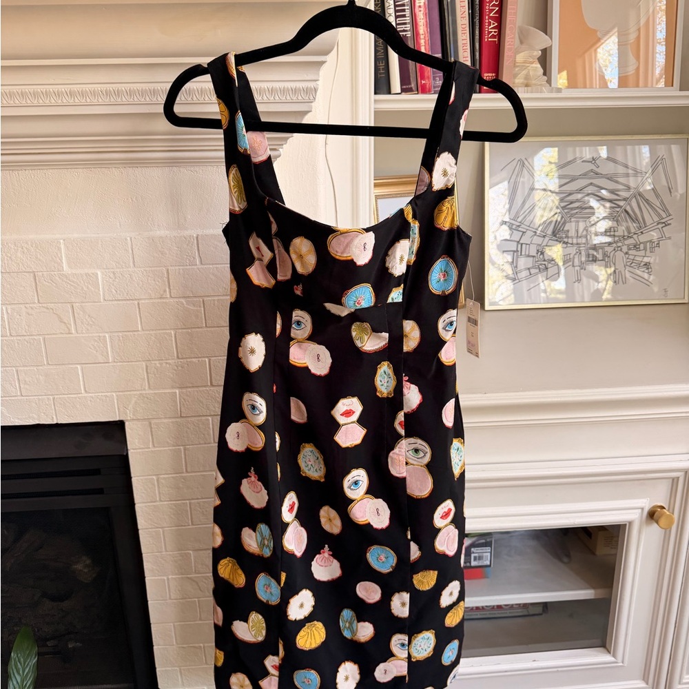 Maeve Danielle Kroll makeup vanity mirror pattern dress